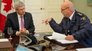 Stephen Harper receives a purported briefing from RCMP Commissioner Robert "Bob" Paulson. 